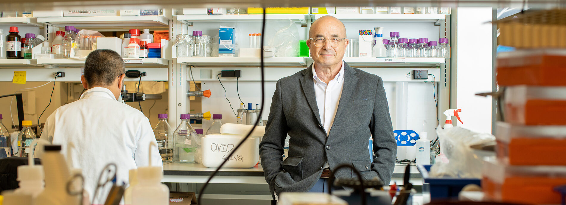 Jeremy Levin, chief executive officer of Ovid Therapeutics, stands against a bench in a lab.